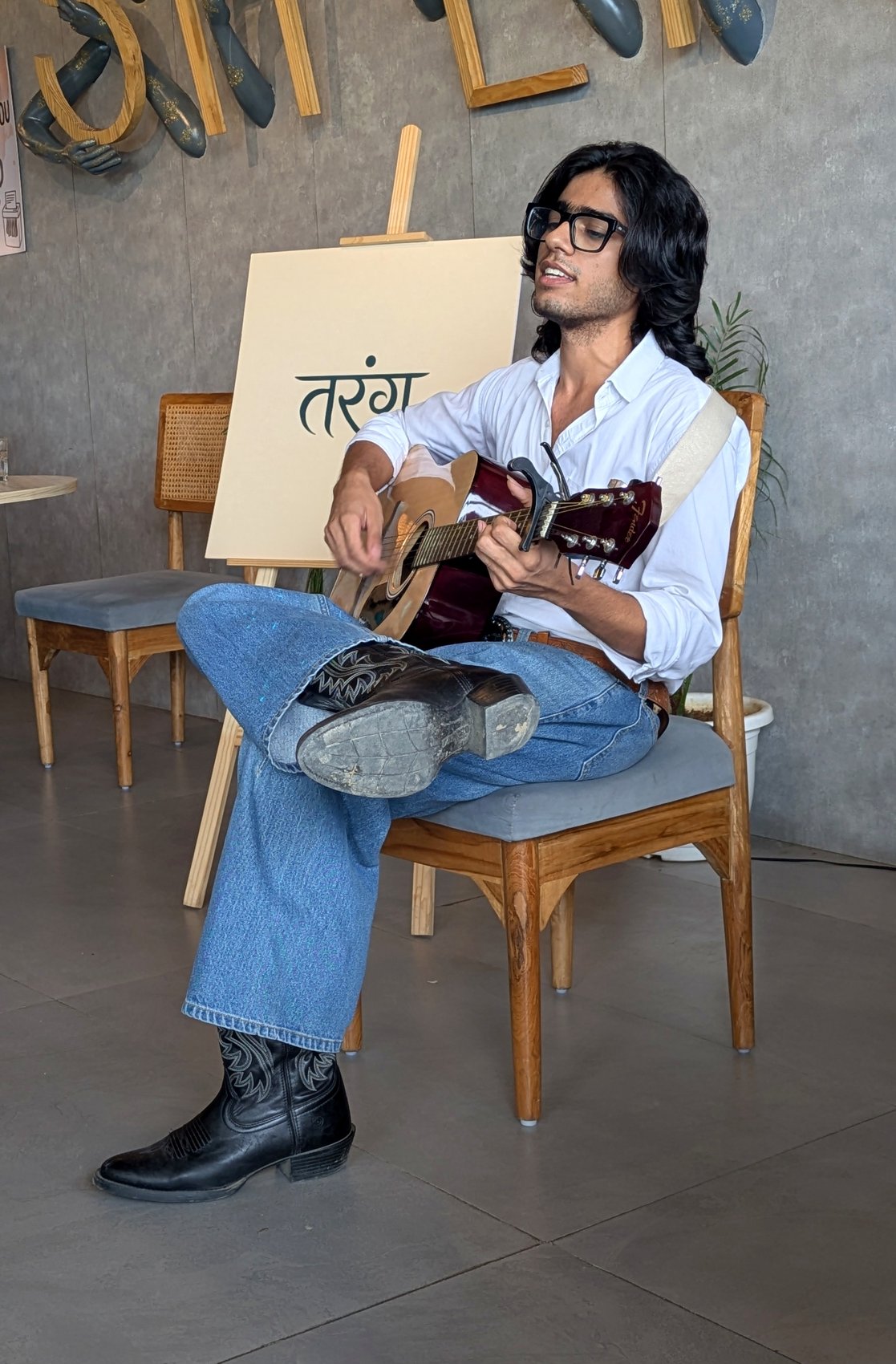 Musician playing guitar at an Artist for Gigs event