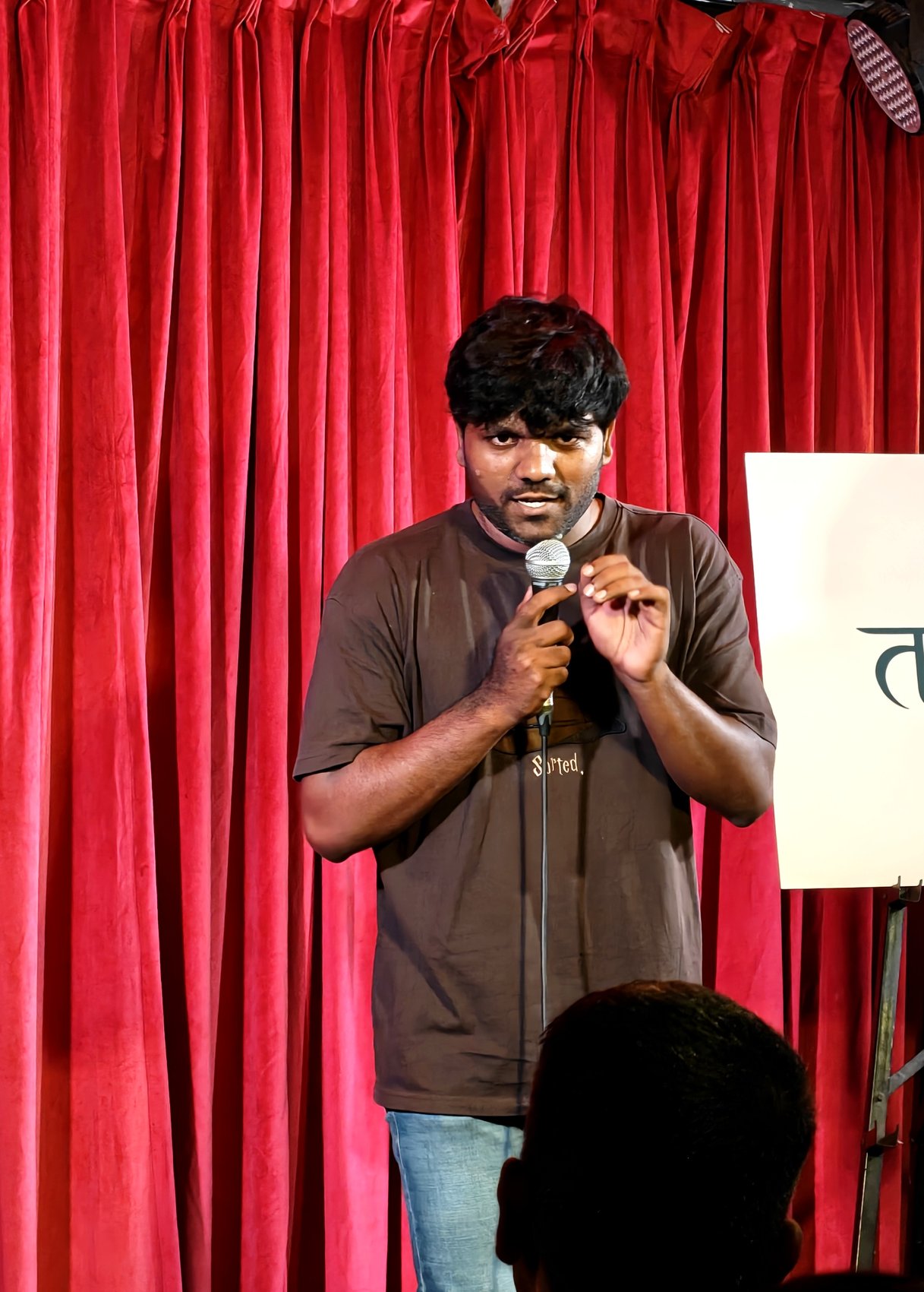 Comic performing at Tarang open mic